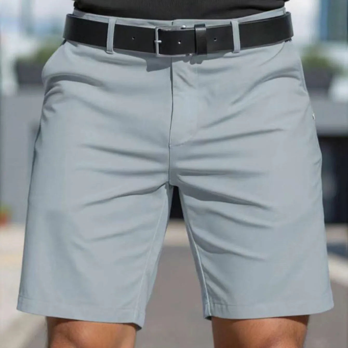 Men's solid colour straight-leg polyester shorts with micro elasticity, shown in apricot.
