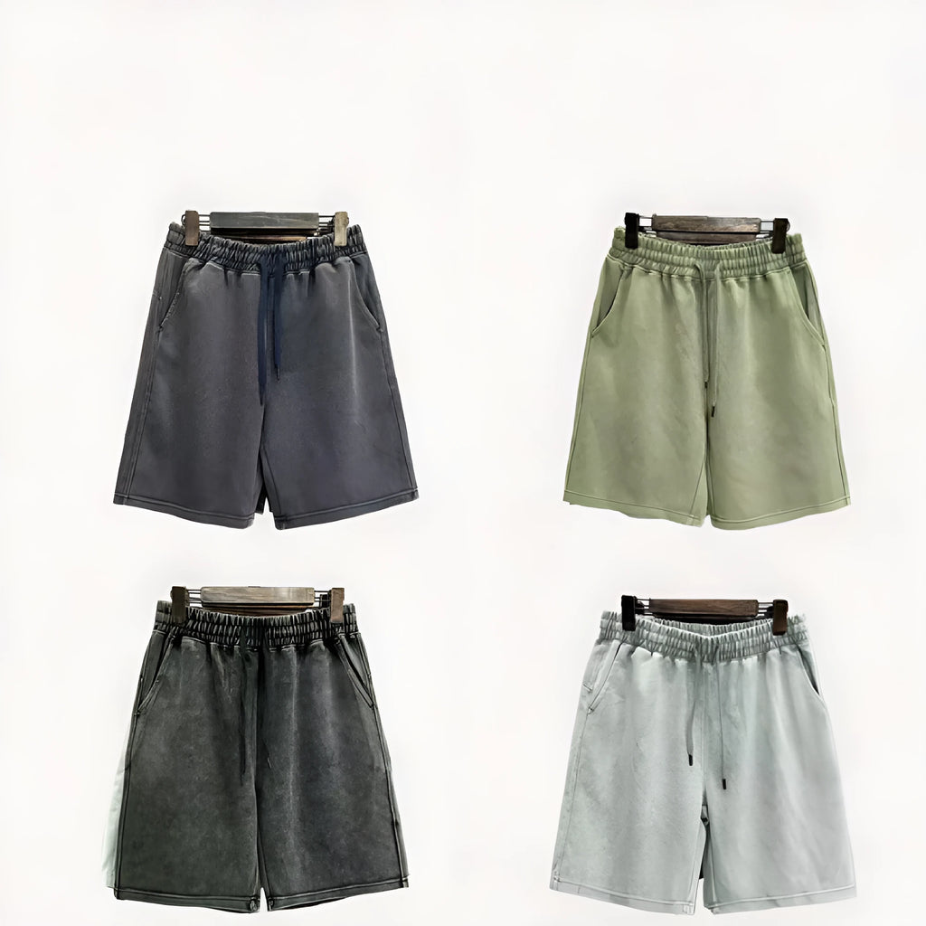 Men's light blue cotton shorts with distressed detailing and a loose, straight-leg fit on a mannequin.