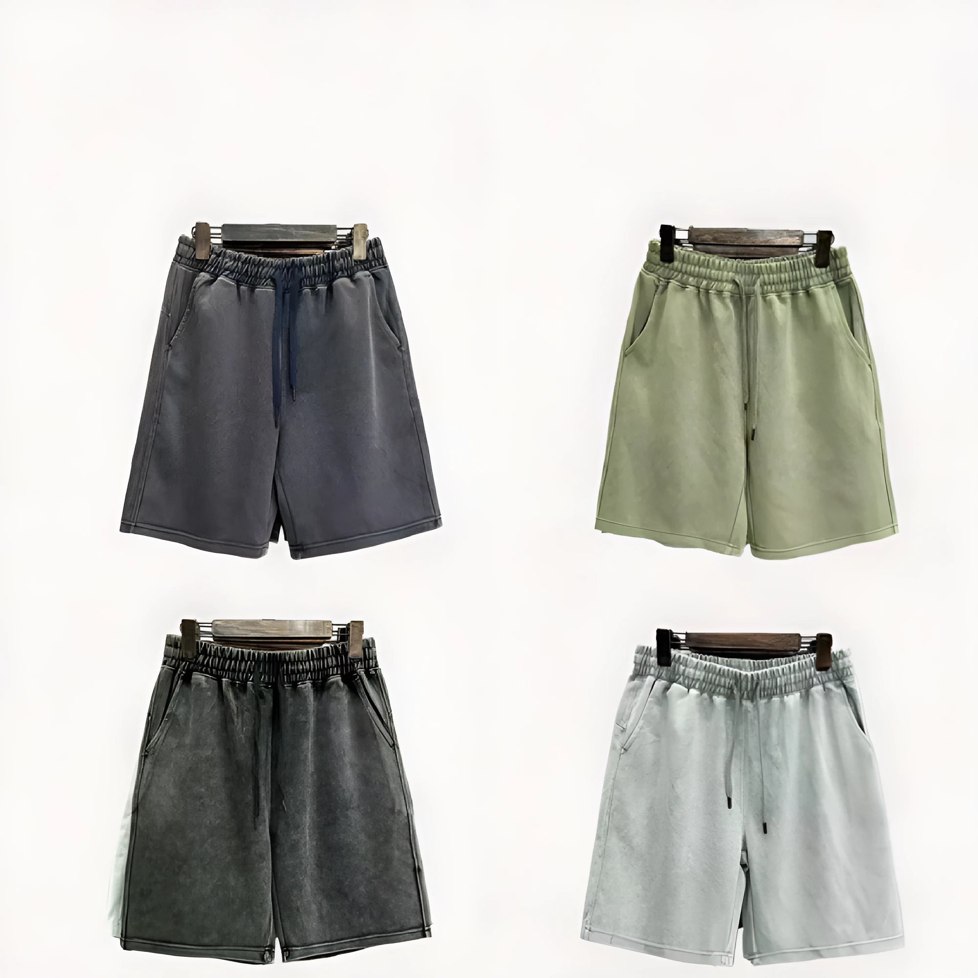 Men's light blue cotton shorts with distressed detailing and a loose, straight-leg fit on a mannequin.