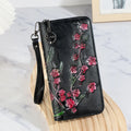 Embossed floral pattern Chinese style handbag in brown colour with zipper closure