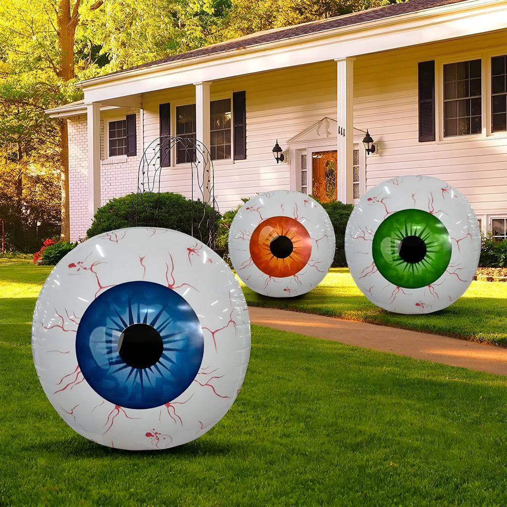 Green Halloween balloon with large bloodshot eyeball design, shown inflated