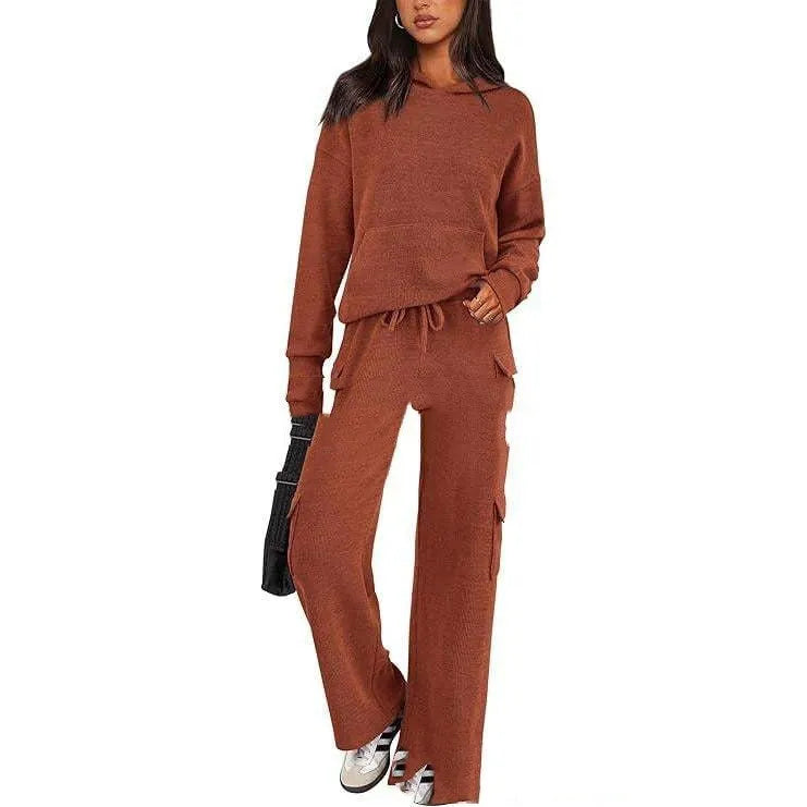 Women's two-piece polyester leisure suit in a solid colour, showing long sleeves and full-length trousers.
