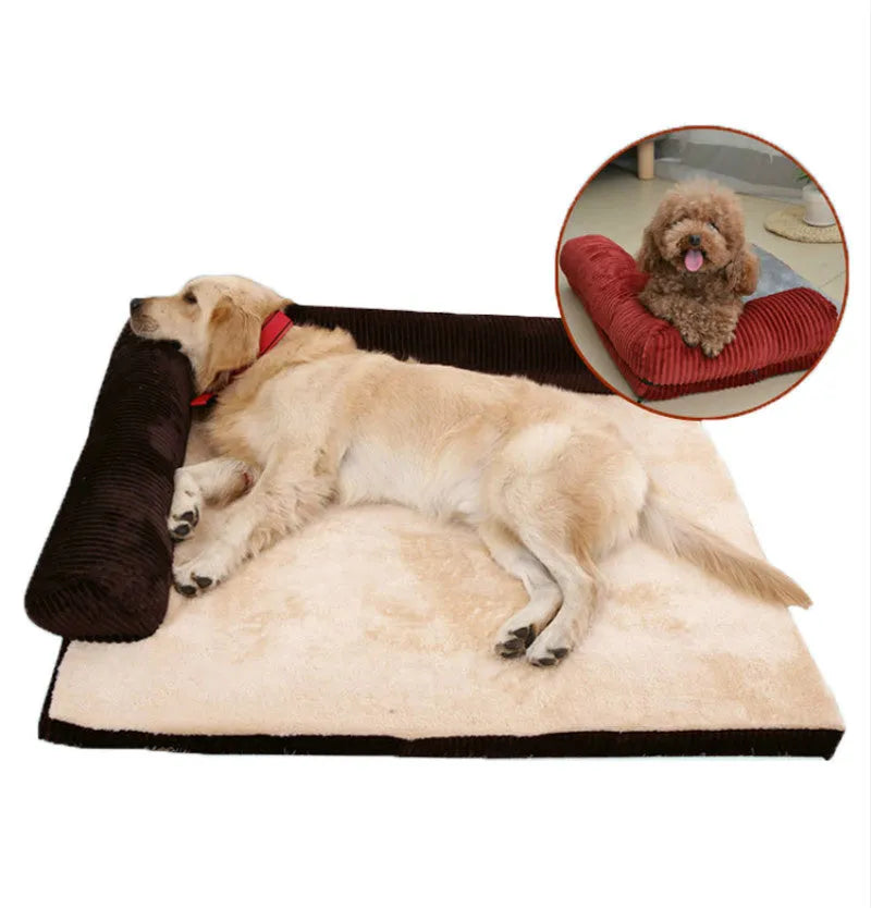 A corduroy pet sofa dog bed with a raised bolster, shown in a grey colour on a wooden floor.