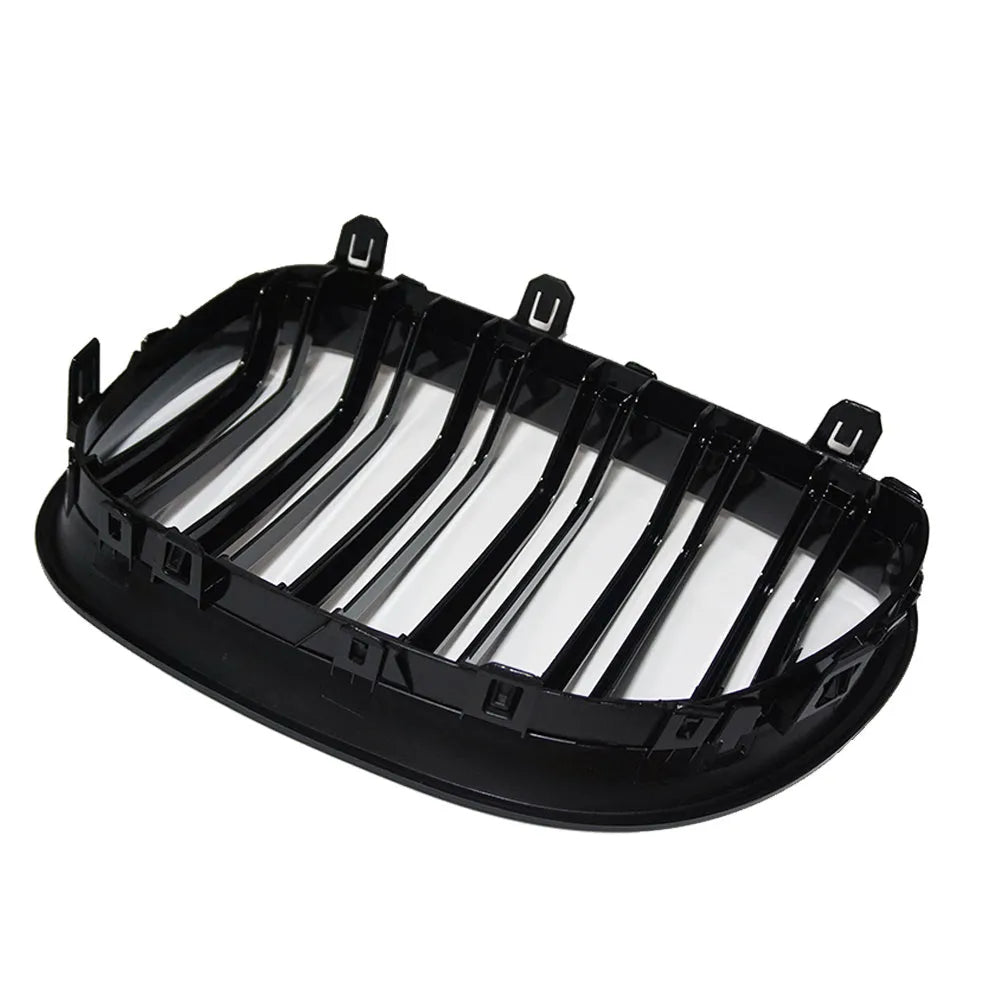 Carbon fibre pattern front grille for BMW 5-Series E60 E66 models on black background.