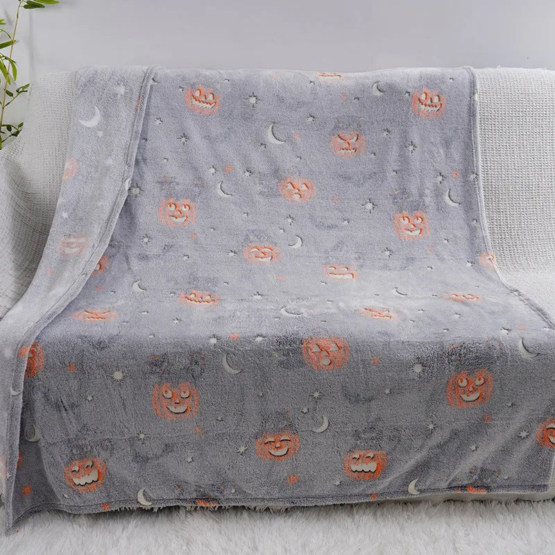 Cartoon style flannel child blanket shown covering an air conditioner, available in multiple colours.