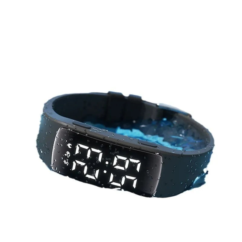 Vibration alarm clock watch with LED display on silicone strap showing multiple colour options