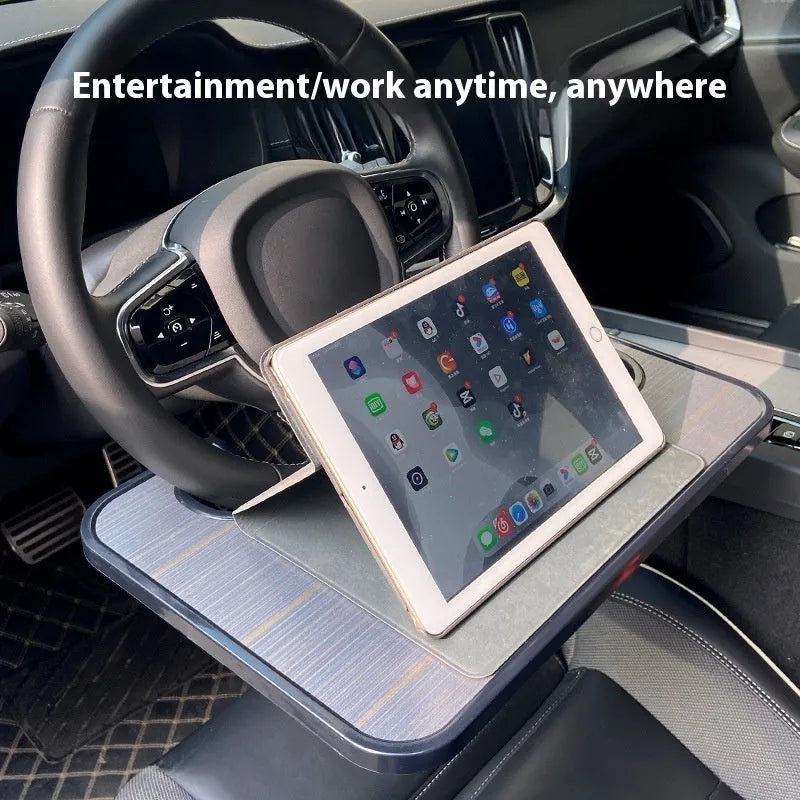Black foldable car steering wheel tray with laptop and drink cup holder deployed