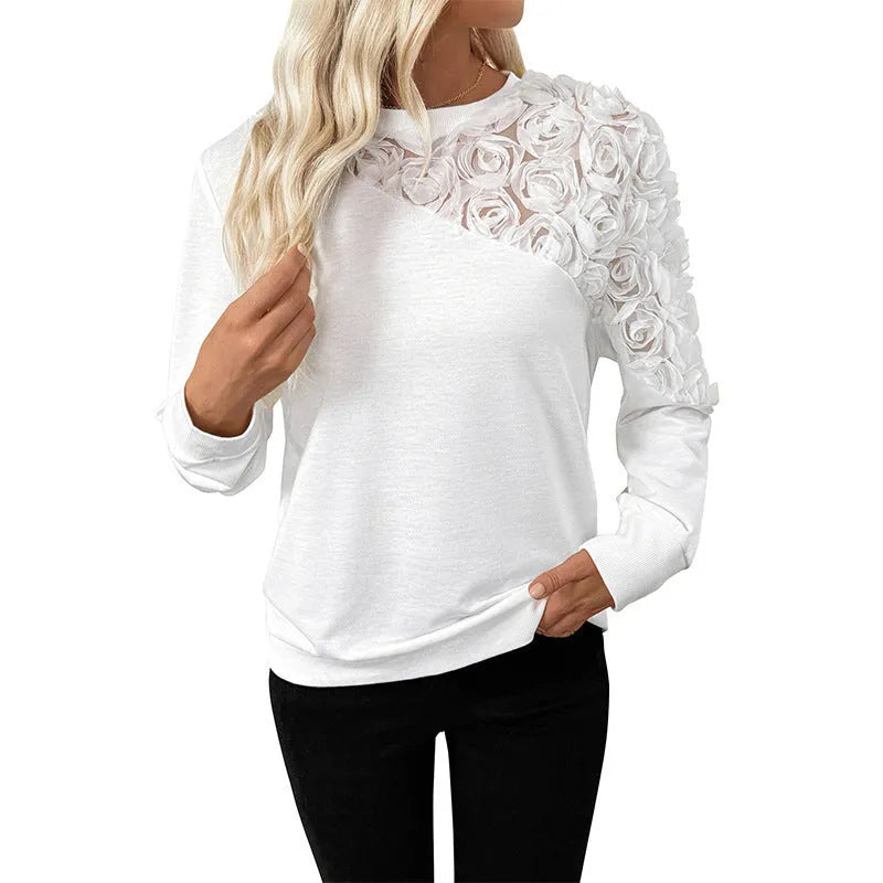White women's long sleeve top with floral pattern, loose fit pullover style