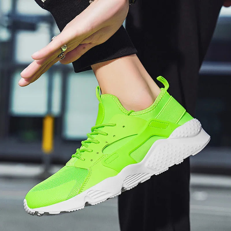 Men's low top casual shoes with mesh upper and cross shoulder straps in fluorescent colours