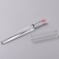 Set of coloured silicone lip brushes with protective caps for applying lipstick and lip gloss.