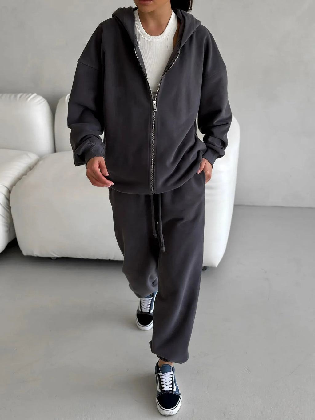 Street style loose-fit two-piece set with long-sleeved coat and trousers in grey.