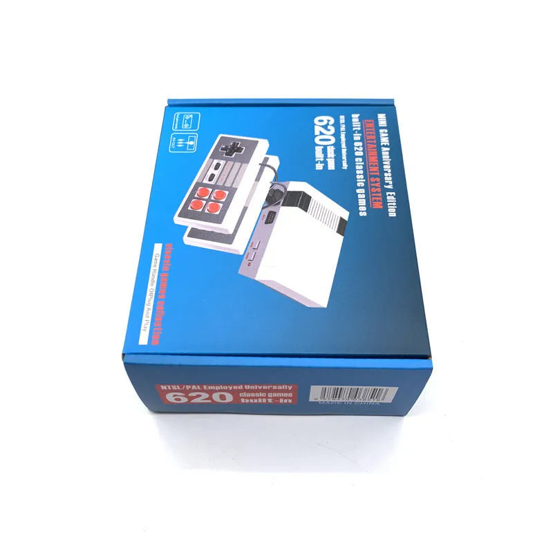 Red and grey NES retro mini game console with two rectangular controllers on a table.