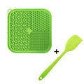 Blue silicone dog lick mat with textured surface and suction cups on back, shown on a tiled floor.