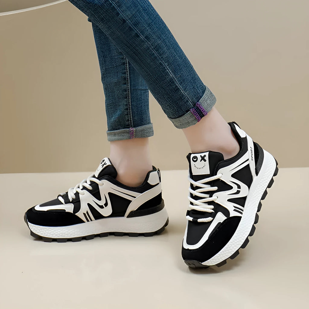 Women's black lace-up platform casual sports shoes with round toe and flat heel.