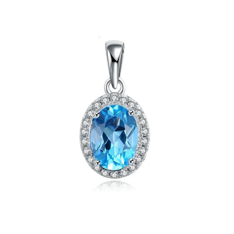 Four-piece 925 Sterling Silver geometric jewellery set with blue topaz gems, showing earrings, ring, pendant, and necklace.