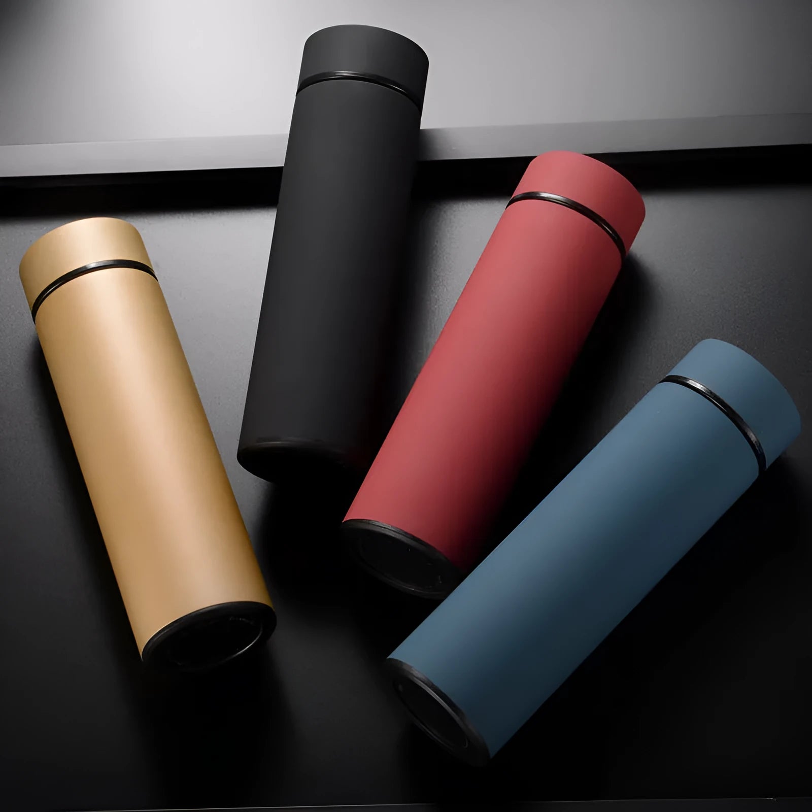 450ml stainless steel vacuum water bottle in black, red, gold, and blue colours with double wall insulation