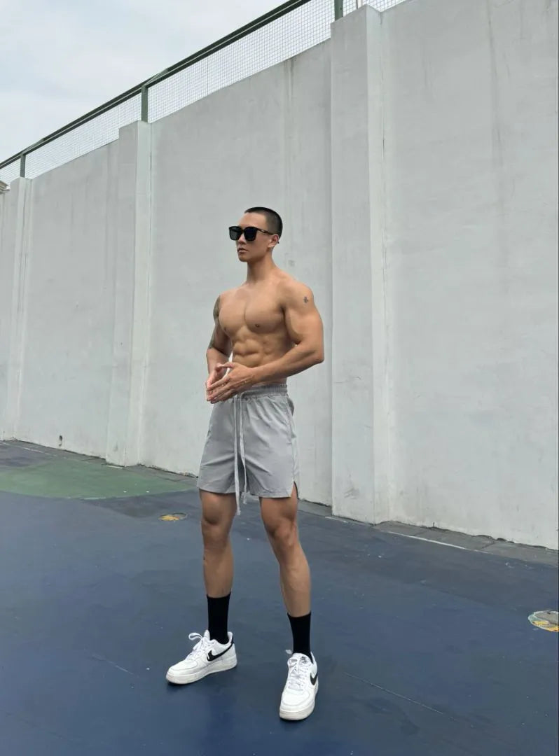Men's quick-drying double-layer nylon shorts shown in multiple colours.