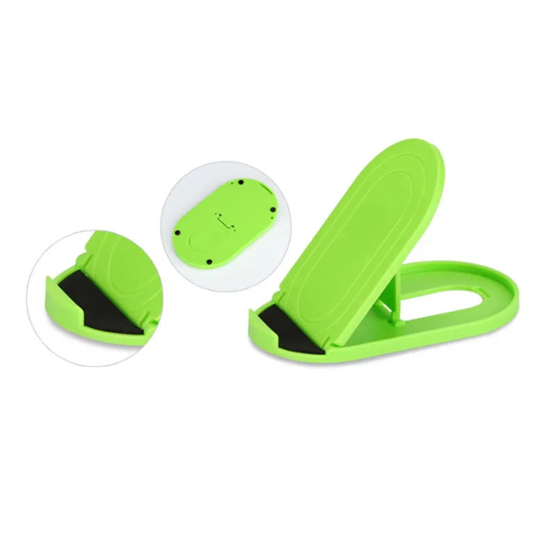 Plastic mobile phone stand with lazy bracket design in six colour options on a table.
