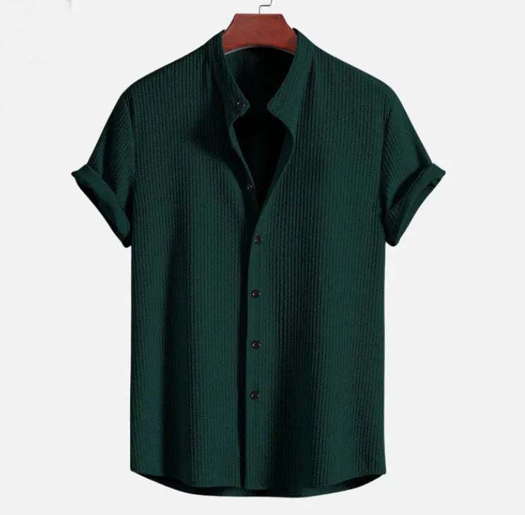Men's loose fit short sleeve polyester summer shirt on a hanger, shown in a light blue colour.