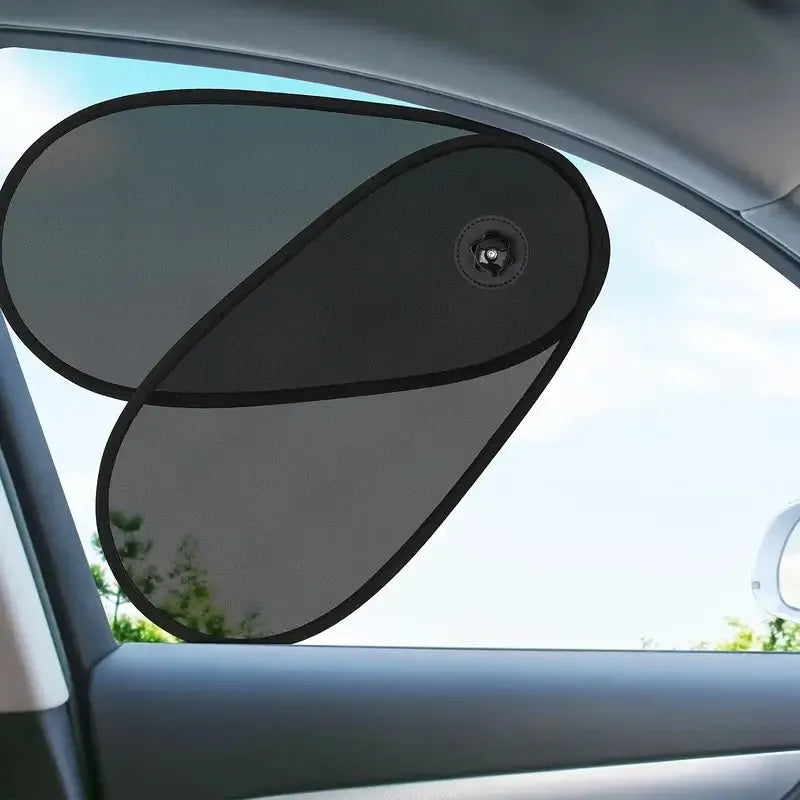 Black breathable car window shades stretched across a car side window with suction cup attachments