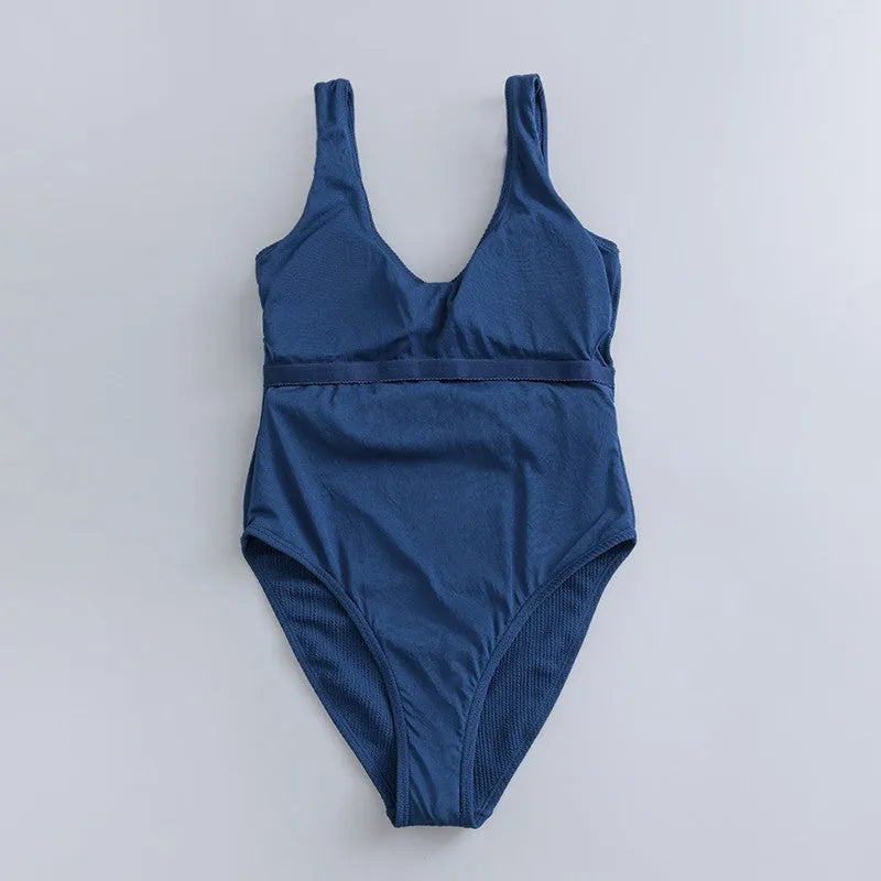 Navy blue women's one-piece slimming triangle swimsuit with a removable chest pad.