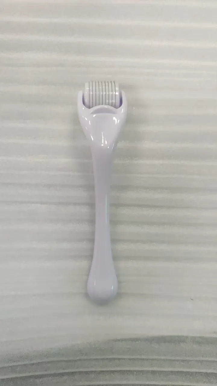 Black handle micro needle roller with purple wheel showing 540 stainless steel needles for dermaplaning