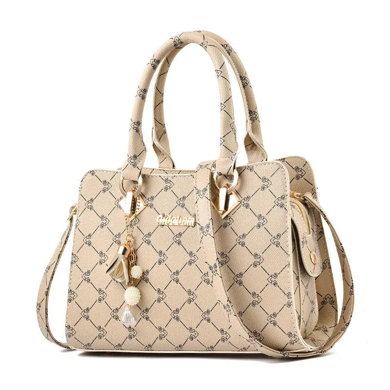 Women's geometric print PU leather messenger bag with internal organisers and zip closure.