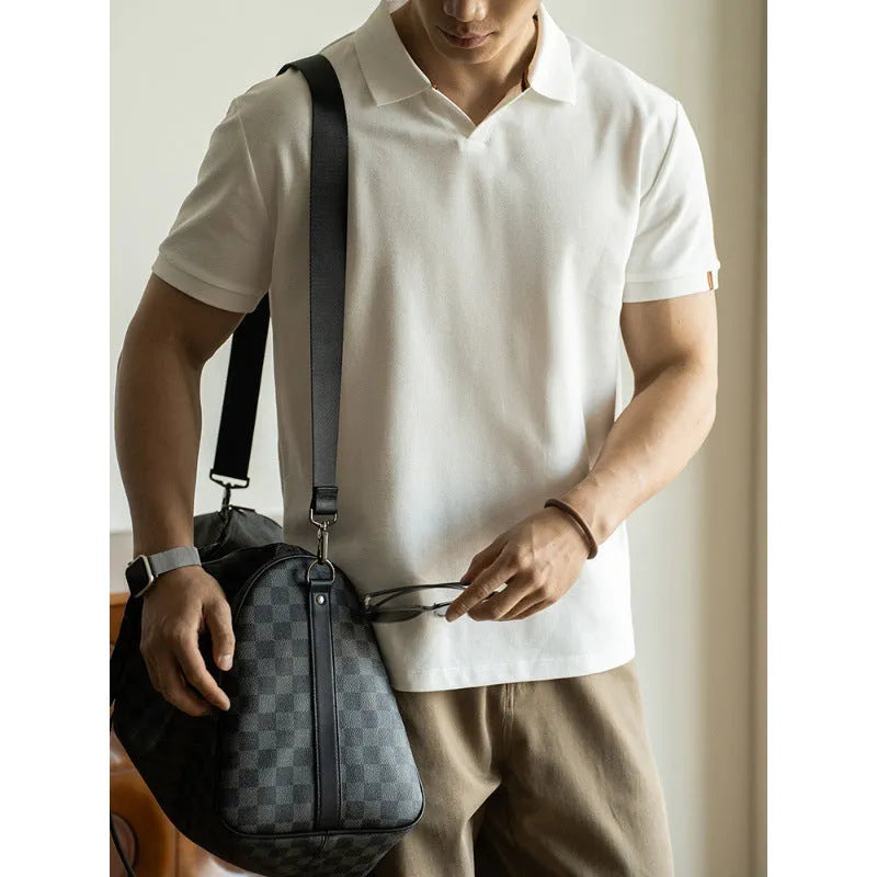 Blue cotton polyester blend short-sleeved polo shirt on a hanger, showing regular fit and casual style.