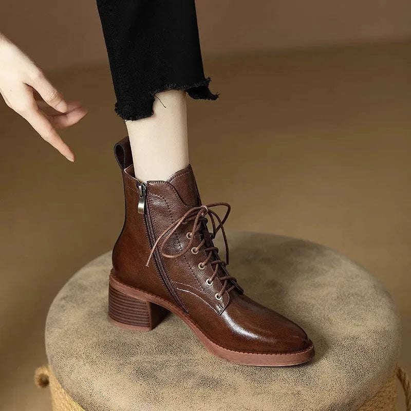 Women's black pointed toe short tube boots with 5.5cm block heel and ankle shaft height