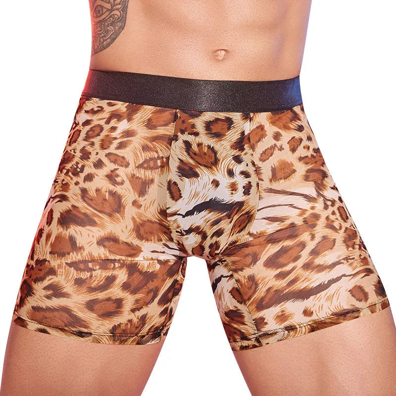 Men's leopard print boxer shorts laid flat, showing elasticated waistband and animal pattern.