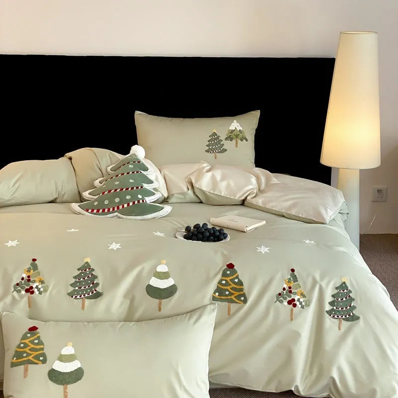Pure cotton duvet cover set with embroidered Christmas trees and flowers, shown in cream blue colour.