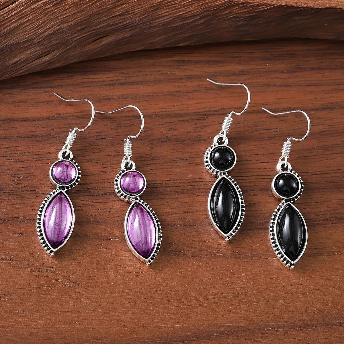 Vintage geometric zinc alloy earrings with electroplated black or purple colour and round pendant elements