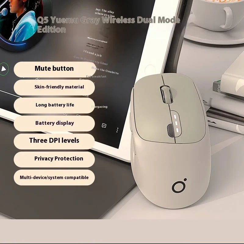 Mute dual-mode wireless Bluetooth computer mouse in Matcha Green colour on a desk.