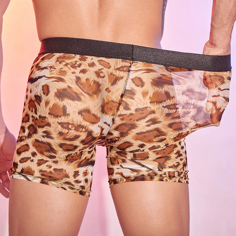 Men's leopard print boxer shorts laid flat, showing elasticated waistband and animal pattern.