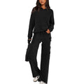 Women's two-piece polyester leisure suit in a solid colour, showing long sleeves and full-length trousers.