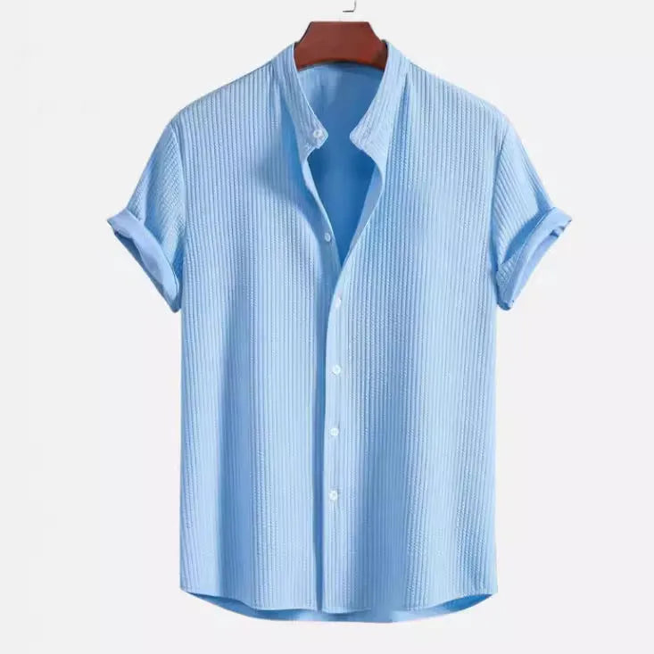 Men's loose fit short sleeve polyester summer shirt on a hanger, shown in a light blue colour.