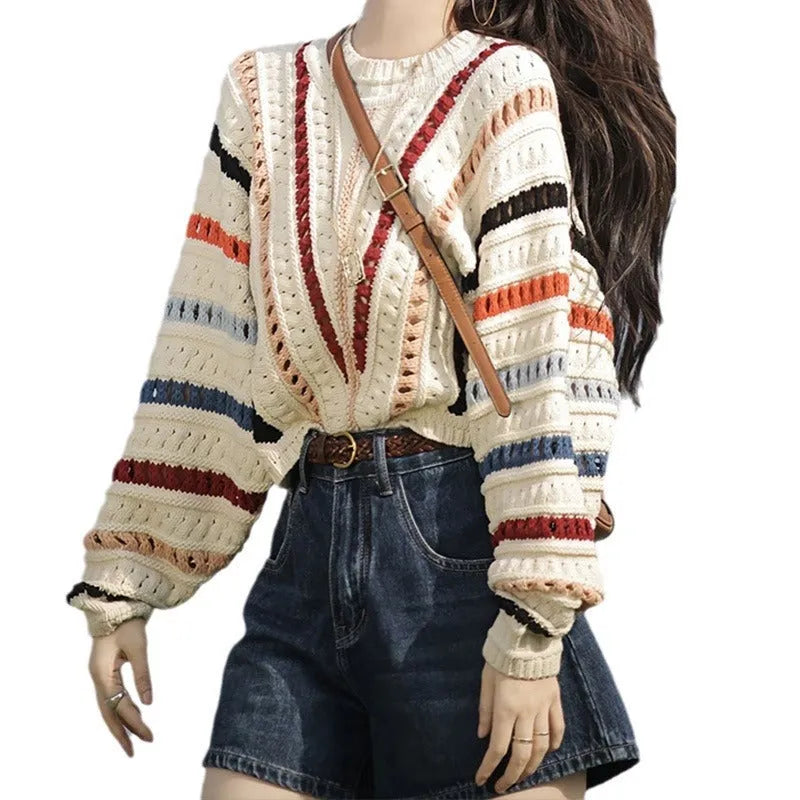 Colourful rainbow striped loose knit sweater with batwing sleeves and a round neck.