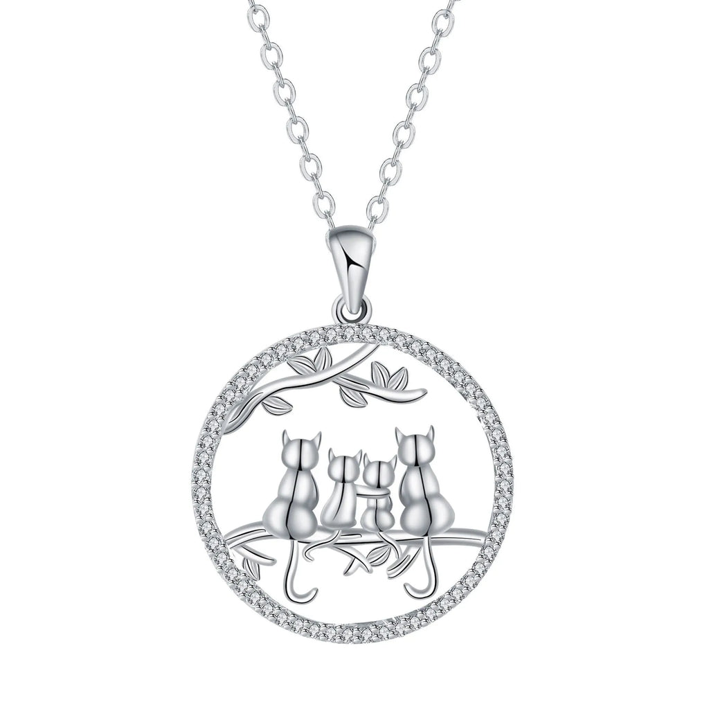 Copper necklace with four kitten pendants on a cross chain, electroplated finish.