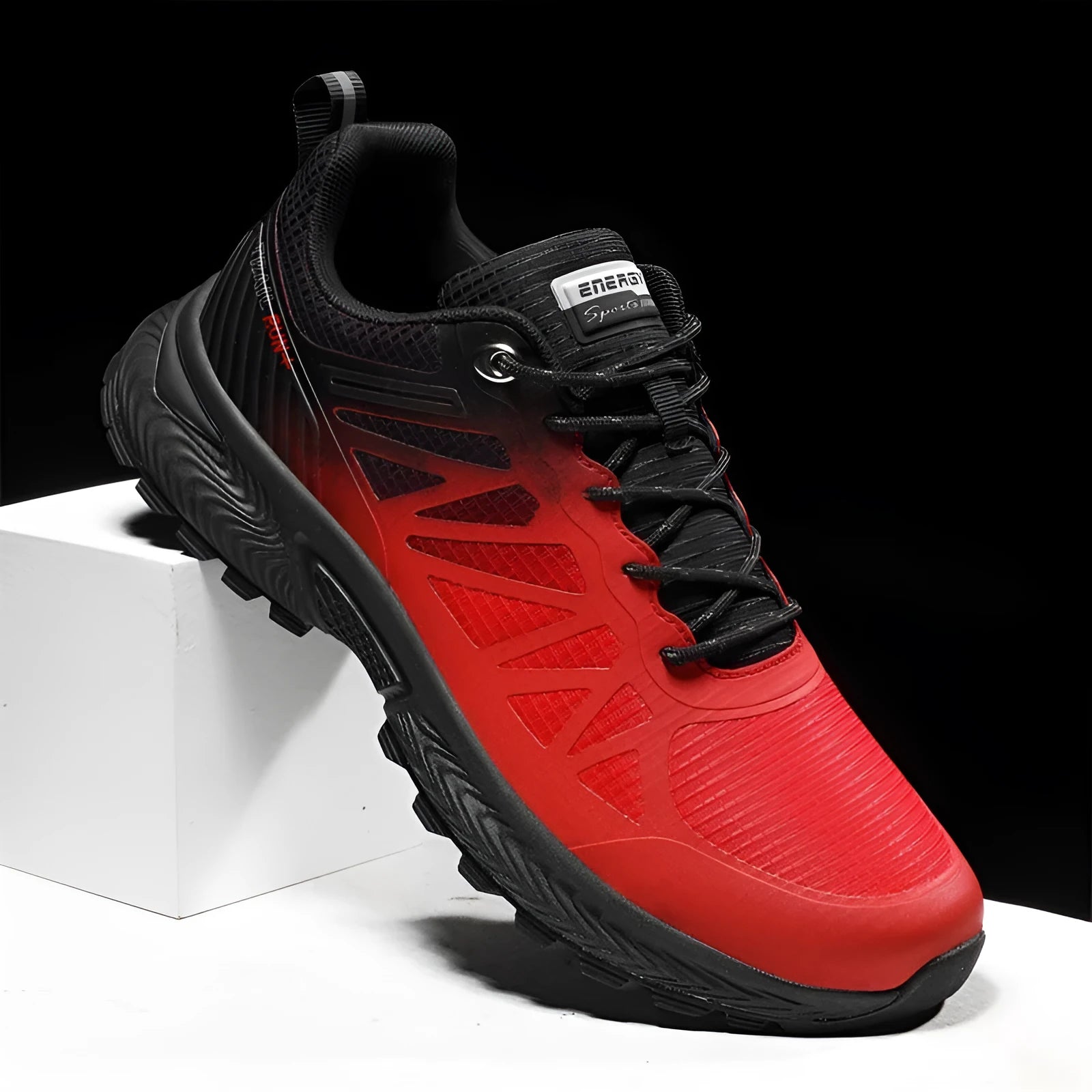 Men's plus size black and orange breathable mesh running shoes with lace-up front and rubber sole.