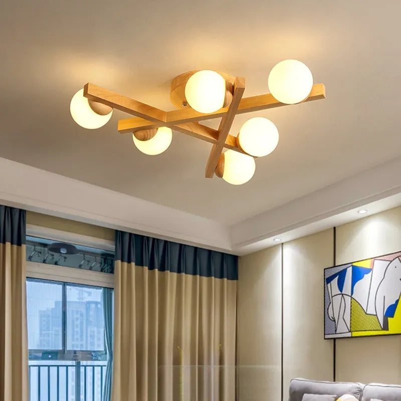 Wooden style modern Nordic ceiling light fixture with three neutral light heads.