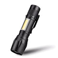 Black aluminium alloy telescopic LED torch with clip, showing extended and retracted zoom positions