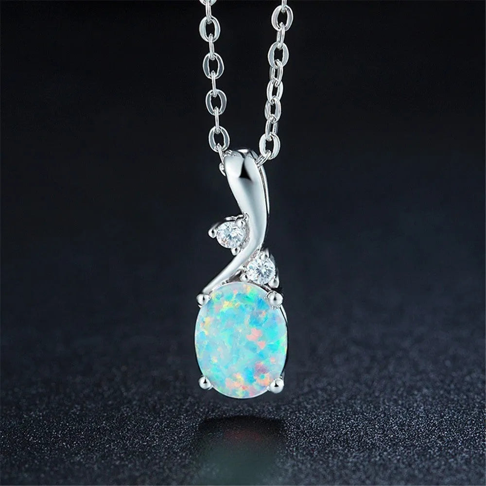 Water drop shaped opal pendant on adjustable chain necklace in rose gold or white finish