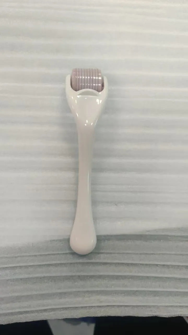 Black handle micro needle roller with purple wheel showing 540 stainless steel needles for dermaplaning