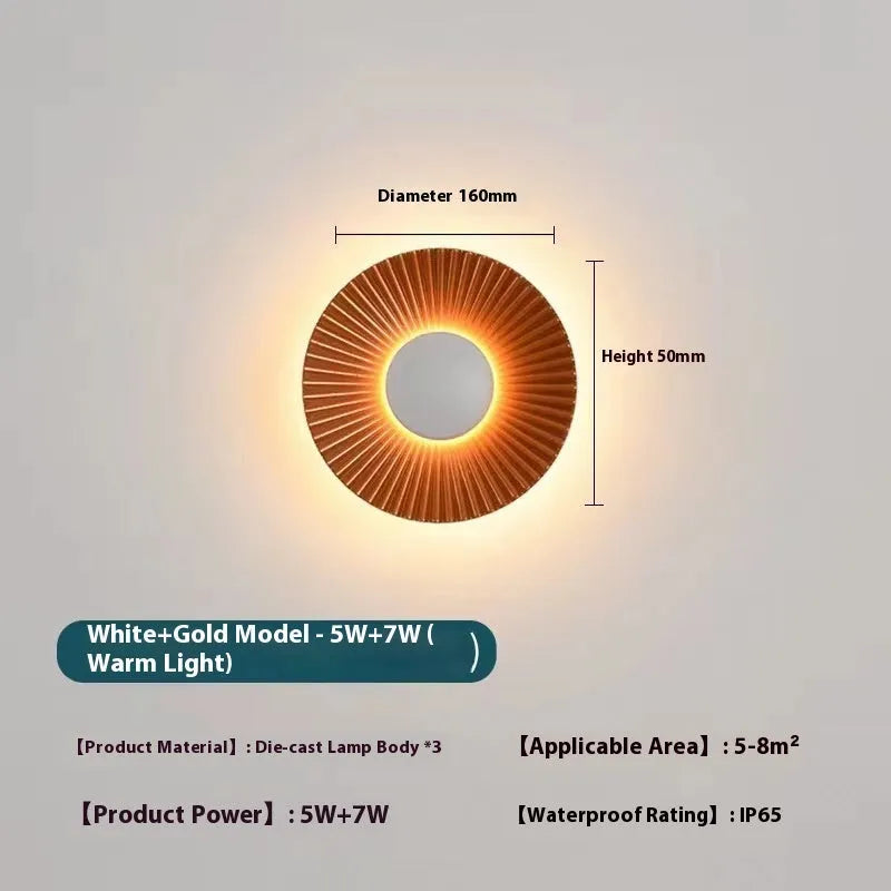 Round aluminium wall lamp with LED light in a choice of colour finishes including white and gold.