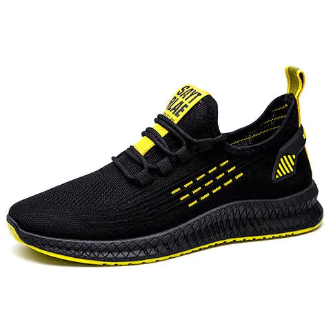 Men's black casual trainers with Flying Weave upper and cross strap detail on low-top sports shoes