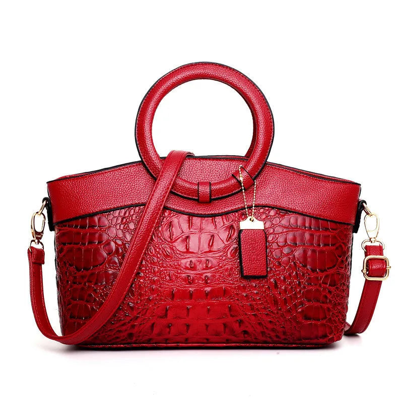 Ladies fabric handbag with multiple zipper compartments in six colour options showing organisational pockets