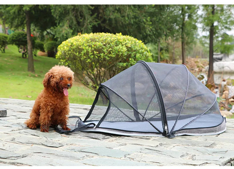 Black half mesh cat folding tent folded for storage with mesh ventilation panels visible