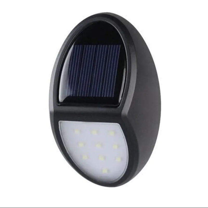 Black solar-powered LED wall light with solar panel and automatic activation