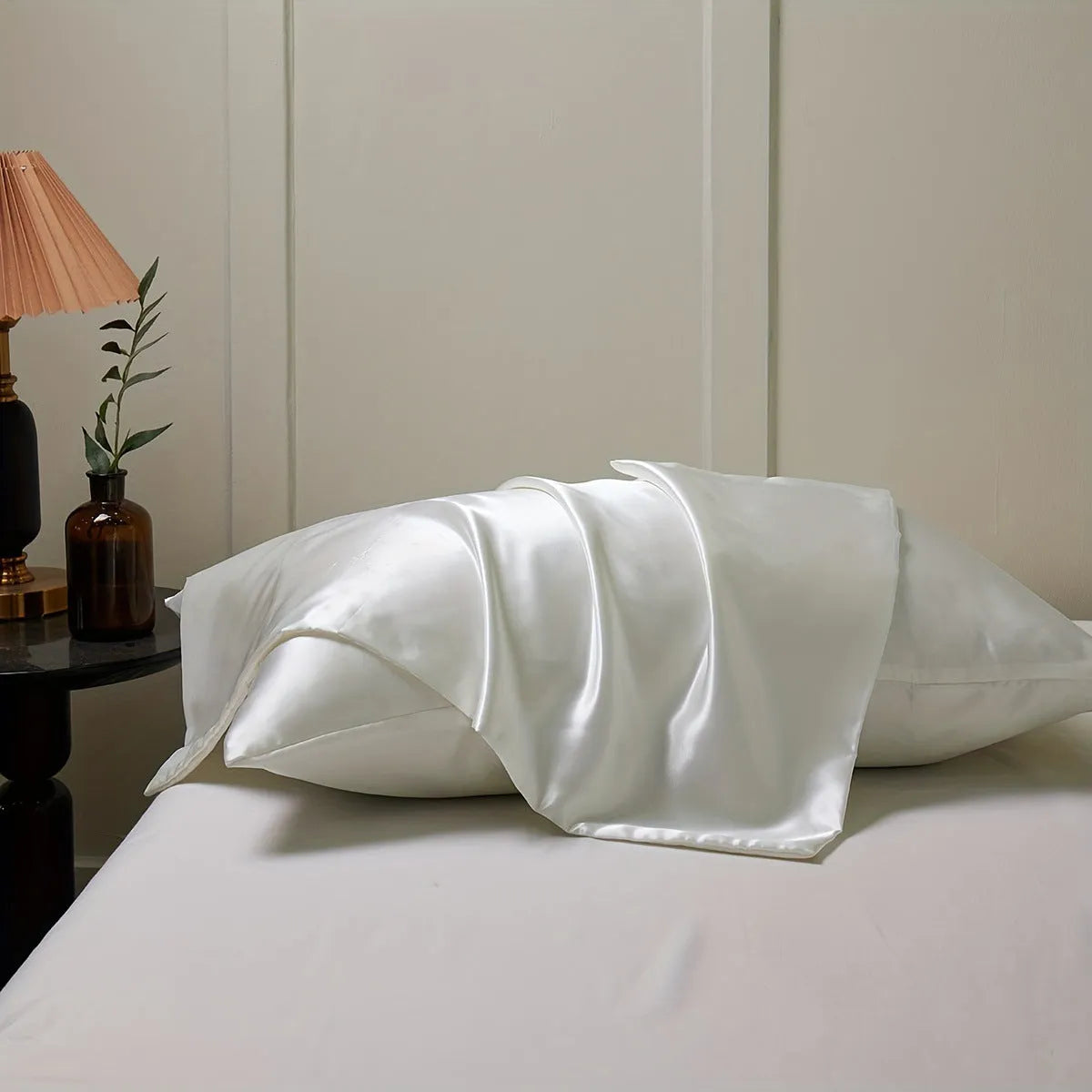 Pair of solid colour satin cloth pillowcases in polyester fibre available in twelve colours and four sizes