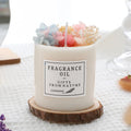 Glass jar scented candle with dried flower decoration, available in multiple fragrance options